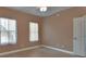 Bedroom featuring wood-look flooring and natural light from two windows at 424 Luna Bella Ln # 330, New Smyrna Beach, FL 32168