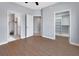 Bedroom featuring multiple doors and closets and wood flooring at 424 Luna Bella Ln # 330, New Smyrna Beach, FL 32168