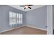 Bedroom featuring wood flooring and a window with sheer curtains at 424 Luna Bella Ln # 330, New Smyrna Beach, FL 32168