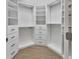 Walk-in closet with built-in shelving and drawers, offering ample storage space at 424 Luna Bella Ln # 330, New Smyrna Beach, FL 32168