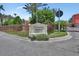 Welcoming entrance to Tuscany Square Condominiums with a well-maintained sign and landscaping at 424 Luna Bella Ln # 330, New Smyrna Beach, FL 32168