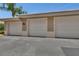 Three white garage doors provide sheltered parking and a clean look at 424 Luna Bella Ln # 330, New Smyrna Beach, FL 32168
