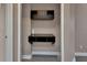Hallway featuring built in shelves and storage cabinet at 424 Luna Bella Ln # 330, New Smyrna Beach, FL 32168
