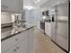 Modern kitchen featuring white cabinets, stainless steel appliances, and granite countertops at 424 Luna Bella Ln # 330, New Smyrna Beach, FL 32168