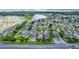 Aerial view of a property and surrounding neighborhood, showcasing proximity to a community pond and well-maintained streets at 452 Casa Marina Pl, Sanford, FL 32771