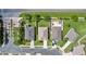 Overhead view of three residential properties, showcasing well-maintained lawns, driveways, and neighborhood streets at 452 Casa Marina Pl, Sanford, FL 32771