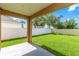 Backyard featuring a lush green lawn and a white fence for privacy at 452 Casa Marina Pl, Sanford, FL 32771
