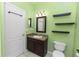 Bathroom featuring a sink, a toilet, floating shelves and a mirror at 452 Casa Marina Pl, Sanford, FL 32771