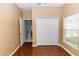 Bedroom with closet and light brown colored wall and hardwood floor at 452 Casa Marina Pl, Sanford, FL 32771