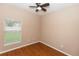 Bright bedroom features a ceiling fan and a window letting in natural light at 452 Casa Marina Pl, Sanford, FL 32771