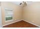 Bedroom with hardwood floor, a window letting in natural light and ceiling fan at 452 Casa Marina Pl, Sanford, FL 32771