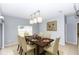 Bright dining room featuring tile floors, a modern light fixture, and elegant table setting at 452 Casa Marina Pl, Sanford, FL 32771