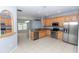 Open kitchen with stainless steel appliances and eat-in bar at 452 Casa Marina Pl, Sanford, FL 32771