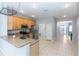 Bright kitchen featuring stainless steel appliances and light wood cabinets at 452 Casa Marina Pl, Sanford, FL 32771