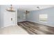 Open-concept living room showcasing wood floors and ample natural light at 452 Casa Marina Pl, Sanford, FL 32771