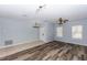Open-concept living room showcasing wood floors and ample natural light at 452 Casa Marina Pl, Sanford, FL 32771