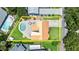 Aerial view of property highlighting pool, outdoor living space, and landscaping at 4638 Saxon Dr, New Smyrna Beach, FL 32169