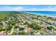 Aerial view of the house with a pool, close to the beach and city amenities at 4638 Saxon Dr, New Smyrna Beach, FL 32169