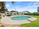 Beautiful backyard pool with lush landscaping, patio area, and well-maintained lawn at 4638 Saxon Dr, New Smyrna Beach, FL 32169