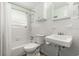 Bright bathroom featuring a bathtub, modern fixtures, and clean white tile creating a refreshing space at 4638 Saxon Dr, New Smyrna Beach, FL 32169