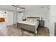 This spacious bedroom boasts a neutral palette, tile floors, natural light, and ample storage at 4638 Saxon Dr, New Smyrna Beach, FL 32169