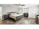A serene bedroom features a neutral palette, tile floors, lots of storage and ample natural light at 4638 Saxon Dr, New Smyrna Beach, FL 32169