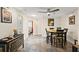 Comfortable dining room adjacent to living area and kitchen, featuring neutral walls and stylish flooring at 4638 Saxon Dr, New Smyrna Beach, FL 32169