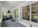 Charming front porch with seating area, decorative fish art, and large window at 4638 Saxon Dr, New Smyrna Beach, FL 32169