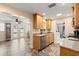 Well-lit kitchen with stainless steel dishwasher, stainless steel refrigerator and view of pool area at 4638 Saxon Dr, New Smyrna Beach, FL 32169