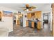 An open concept kitchen and living area showcasing a wet bar, tile flooring and natural lighting at 4638 Saxon Dr, New Smyrna Beach, FL 32169