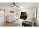 Comfortable living room features neutral walls, stylish flooring, and a view to the kitchen at 4638 Saxon Dr, New Smyrna Beach, FL 32169