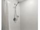 Close up of shower with modern fixtures and white tiled walls at 4638 Saxon Dr, New Smyrna Beach, FL 32169