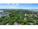 A high aerial view of the property showing its location between the beach and waterway with a yellow arrow at 4791 S Peninsula Dr, Ponce Inlet, FL 32127