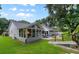 Picturesque backyard featuring a well-manicured lawn and outdoor dining area at 4791 S Peninsula Dr, Ponce Inlet, FL 32127