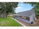 Picturesque backyard featuring a well-manicured lawn and outdoor dining area at 4791 S Peninsula Dr, Ponce Inlet, FL 32127
