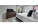 Comfortable bedroom features a cozy bed, dresser, and tranquil decor at 4791 S Peninsula Dr, Ponce Inlet, FL 32127