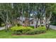 Charming single-story home with well-maintained landscaping and mature trees at 4791 S Peninsula Dr, Ponce Inlet, FL 32127