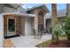 This home has a cozy brick front porch with seating, great for relaxation and visiting at 4791 S Peninsula Dr, Ponce Inlet, FL 32127