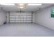 Spacious garage with ample room for parking and storage with automatic garage door at 4791 S Peninsula Dr, Ponce Inlet, FL 32127