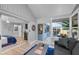 Inviting living room with patio access and seamless flow into the primary bedroom at 4791 S Peninsula Dr, Ponce Inlet, FL 32127