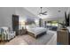 Spacious primary bedroom suite with king bed and sitting area, bathed in natural light at 4791 S Peninsula Dr, Ponce Inlet, FL 32127