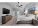 Bright primary bedroom offers ample space, ceiling fan, and convenient bathroom access at 4791 S Peninsula Dr, Ponce Inlet, FL 32127