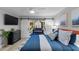 Bright main bedroom boasting sliding barn doors leading to a sunroom at 4791 S Peninsula Dr, Ponce Inlet, FL 32127