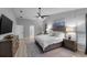 Relaxing primary bedroom includes a king bed, a ceiling fan and an ensuite bathroom at 4791 S Peninsula Dr, Ponce Inlet, FL 32127