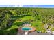 Breathtaking aerial view of the beautiful pool, landscape and luxurious home at 4885 State Road 11, De Leon Springs, FL 32130