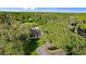 View of estate with mature trees showcasing the property's landscape and serene country setting at 4885 State Road 11, De Leon Springs, FL 32130