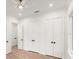 Large closet space with double doors, laminate floors, and natural light at 4885 State Road 11, De Leon Springs, FL 32130