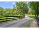 Gravel driveway view leading to home at 4885 State Road 11, De Leon Springs, FL 32130