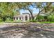 Beautiful property showcasing a decorative fountain and meticulously maintained landscaping at 4885 State Road 11, De Leon Springs, FL 32130