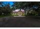 This well-maintained single-story home has a fountain, a tile roof, and a well-manicured lawn at 4885 State Road 11, De Leon Springs, FL 32130